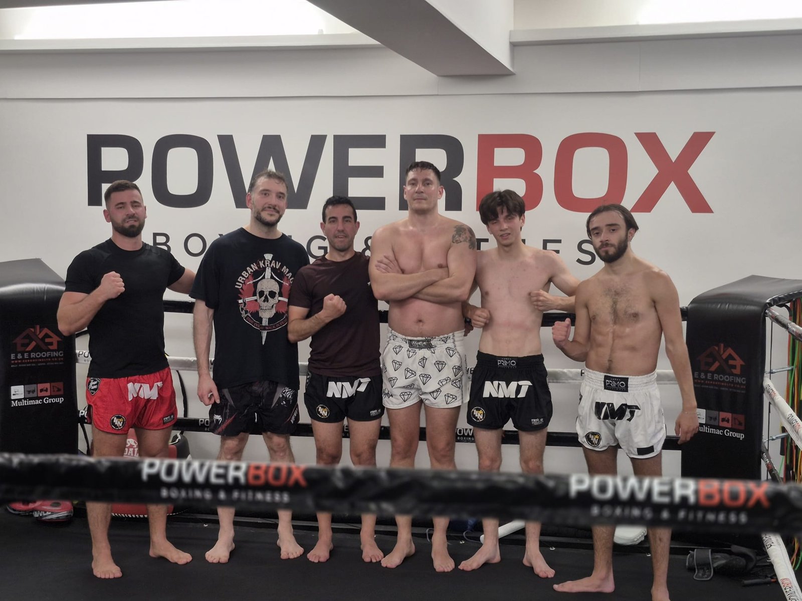 Nolan Muay Thai fighters lined up in the ring at PowerBox Boxing & Fitness